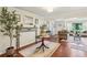Bright living room with hardwood floors, a decorative fireplace, and an open layout to the dining and kitchen at 1600 Belle Isle Ne Cir, Atlanta, GA 30329