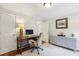 Cozy home office featuring a wooden desk, stylish decor, and ample natural light from the windows at 1600 Belle Isle Ne Cir, Atlanta, GA 30329