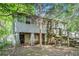 Backyard with elevated structure, stairs, and natural landscape at 239 Haas Se Ave, Atlanta, GA 30316