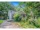 Charming bungalow-style home with a welcoming porch and lush landscaping at 239 Haas Se Ave, Atlanta, GA 30316
