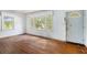 Bright living room with hardwood floors and natural light from the windows and door at 239 Haas Se Ave, Atlanta, GA 30316