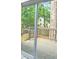 Sliding glass door offers easy access to the back deck and showcases the outdoor living space with trees at 2489 Smith Ave, Marietta, GA 30064