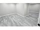Spacious, bright basement with gray wood-style flooring at 2489 Smith Ave, Marietta, GA 30064