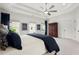Primary bedroom showcases a spacious layout and abundant natural light with tray ceiling at 635 Opera Ln, Alpharetta, GA 30009