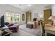 Cozy bedroom features natural light, accent furniture and decor at 635 Opera Ln, Alpharetta, GA 30009
