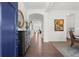 Inviting foyer with hardwood floors, elegant decor, and an arched doorway at 635 Opera Ln, Alpharetta, GA 30009