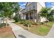 Charming two-story home with a covered front porch, lush landscaping, and inviting curb appeal at 635 Opera Ln, Alpharetta, GA 30009