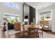 Bright open living area features fireplace, tall ceilings and windows, and comfortable seating at 635 Opera Ln, Alpharetta, GA 30009