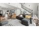Open floor plan showcases a seamless transition between the kitchen, living area, and staircase at 635 Opera Ln, Alpharetta, GA 30009