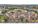 Aerial view of a townhome community highlighting the architecture, city skyline, and surrounding landscape at 1199 Huff Nw Rd # 112, Atlanta, GA 30318