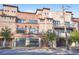 Striking building featuring mixed brick and stone facade, well-kept landscaping, and inviting street presence at 1199 Huff Nw Rd # 112, Atlanta, GA 30318