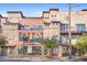 Beautiful building exterior showcasing a mix of brick and stone, balconies, and well-maintained landscaping at 1199 Huff Nw Rd # 112, Atlanta, GA 30318