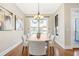 Charming dining room with hardwood floors, neutral paint, and access to the balcony at 1199 Huff Nw Rd # 112, Atlanta, GA 30318
