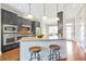 Modern kitchen with stainless appliances, granite counters, and a breakfast bar with pendant lighting at 1199 Huff Nw Rd # 112, Atlanta, GA 30318