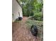 Side yard of home with AC units and a water hose at 3962 Fox Glen Dr, Woodstock, GA 30189