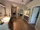 Bathroom featuring a double vanity, modern lighting, wood-look flooring and framed mirrors at 3962 Fox Glen Dr, Woodstock, GA 30189