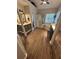 Bright bathroom featuring a shower, tub, double vanity, and wood-look flooring at 3962 Fox Glen Dr, Woodstock, GA 30189