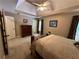 Bedroom features a tray ceiling, carpet flooring, and ample space at 3962 Fox Glen Dr, Woodstock, GA 30189