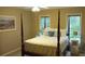 This bedroom features two windows and a four poster bed at 3962 Fox Glen Dr, Woodstock, GA 30189