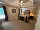 Spacious bedroom with tray ceiling, carpet, and abundant natural light from the windows at 3962 Fox Glen Dr, Woodstock, GA 30189