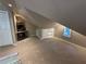Finished attic featuring lots of space, carpet, a ceiling fan, and a desk at 3962 Fox Glen Dr, Woodstock, GA 30189