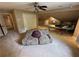 Finished attic featuring lots of space, carpet, a ceiling fan, and a desk at 3962 Fox Glen Dr, Woodstock, GA 30189