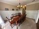 Dining room showcasing a long wooden table with beautiful trim work and details at 3962 Fox Glen Dr, Woodstock, GA 30189