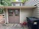Exterior side of house with double doors and a large trash container at 3962 Fox Glen Dr, Woodstock, GA 30189