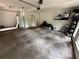 Large two-car garage with storage shelves and door to the house at 3962 Fox Glen Dr, Woodstock, GA 30189