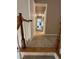 A well-lit second floor hallway with carpeted floor and wood railings at 3962 Fox Glen Dr, Woodstock, GA 30189