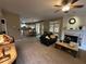Open living room featuring a fireplace and seamless transition to the kitchen and dining area at 3962 Fox Glen Dr, Woodstock, GA 30189
