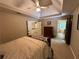 Bedroom with a tray ceiling, large window, and ensuite bathroom at 3962 Fox Glen Dr, Woodstock, GA 30189