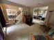 Bright home office with carpet flooring and natural light, and views of dining room at 3962 Fox Glen Dr, Woodstock, GA 30189