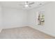 Bright bedroom with white walls and carpet, illuminated by natural light through the window at 4179 Hanes Dr, Decatur, GA 30035