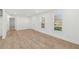 Expansive living room with new laminate flooring, natural light and neutrally painted walls at 4179 Hanes Dr, Decatur, GA 30035