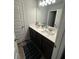 Bathroom featuring a dual sink vanity with plentiful countertop space and modern fixtures at 495 Sterling Creek Way, Loganville, GA 30052