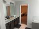Bathroom with double sink vanity, and marble tile flooring at 495 Sterling Creek Way, Loganville, GA 30052