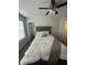 Bedroom includes a bed with decorative headboard, plush pillows, and an adjacent closet at 495 Sterling Creek Way, Loganville, GA 30052