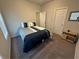 Bedroom featuring a comfortable bed, a side table, and a large window, offering a cozy retreat at 495 Sterling Creek Way, Loganville, GA 30052