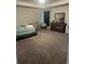 Spacious carpeted bedroom with tray ceiling, bed, ceiling fan, dresser, and window at 495 Sterling Creek Way, Loganville, GA 30052