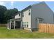 Two-story home with a screened-in porch and large, green backyard at 495 Sterling Creek Way, Loganville, GA 30052