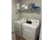 Laundry room with washer, dryer, and wire shelving above at 495 Sterling Creek Way, Loganville, GA 30052