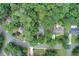Stunning aerial view of a home nestled among lush trees, showcasing the roof and surrounding landscape at 652 Trailwood Sw Ln, Marietta, GA 30064