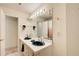 Bright bathroom featuring a dual-sink vanity with sleek fixtures, a large mirror, and ample lighting at 652 Trailwood Sw Ln, Marietta, GA 30064