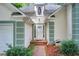 Inviting front entrance with white door, brick walkway, and manicured landscaping at 652 Trailwood Sw Ln, Marietta, GA 30064