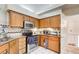 Well-maintained kitchen with wooden cabinets and modern appliances at 652 Trailwood Sw Ln, Marietta, GA 30064