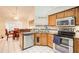 Open concept kitchen with stainless steel appliances and breakfast nook at 652 Trailwood Sw Ln, Marietta, GA 30064