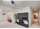 Living room featuring a large TV and adjacent sitting room at 652 Trailwood Sw Ln, Marietta, GA 30064