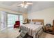 Comfortable main bedroom with a large window and bay window at 652 Trailwood Sw Ln, Marietta, GA 30064