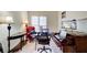 Bright home office setup with a dark wood desk and multiple monitors at 652 Trailwood Sw Ln, Marietta, GA 30064